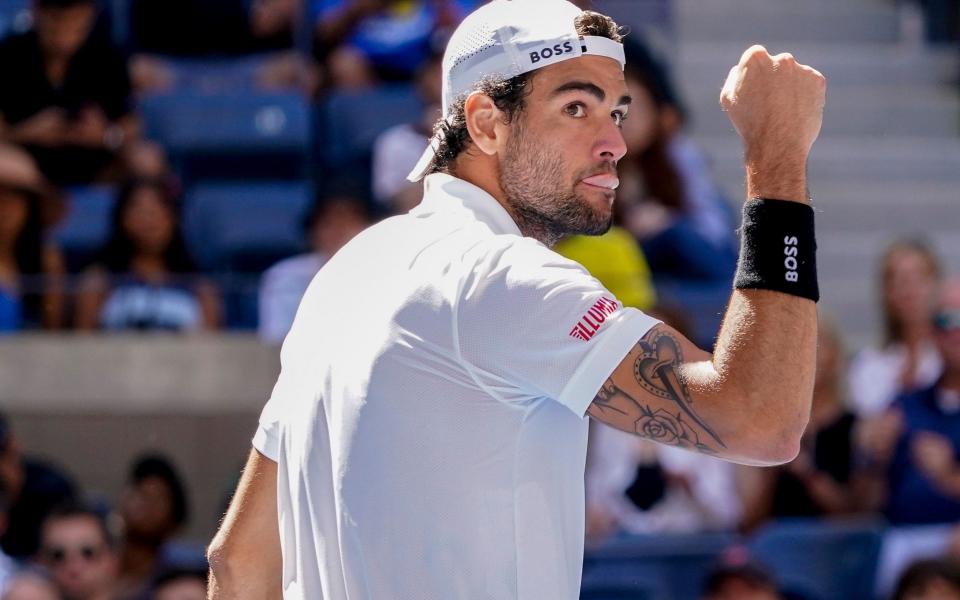 Matteo Berrettini punches the air after taking the second set against Andy Murray - AP