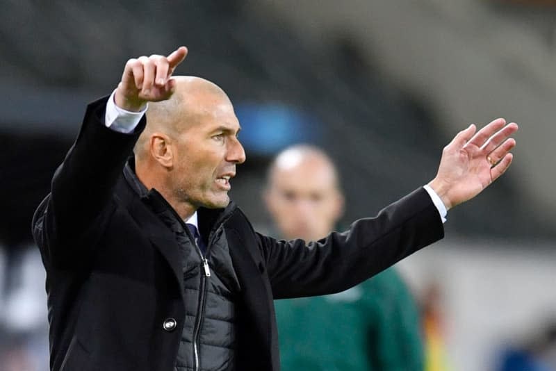 Zinedine Zidane, then Real Madrid coach, stands on the touchline during the UEFA Champions League Group B soccer match between Borussia Moenchengladbach and Real Madrid at the Borussia-Park stadium. Bayern Munich are close to signing  Zidane as coach from summer onwards, Spanish paper Mundo Deportivo reported on 19 April. Marius Becker/Deutsche Presse-Agentur GmbH/dpa