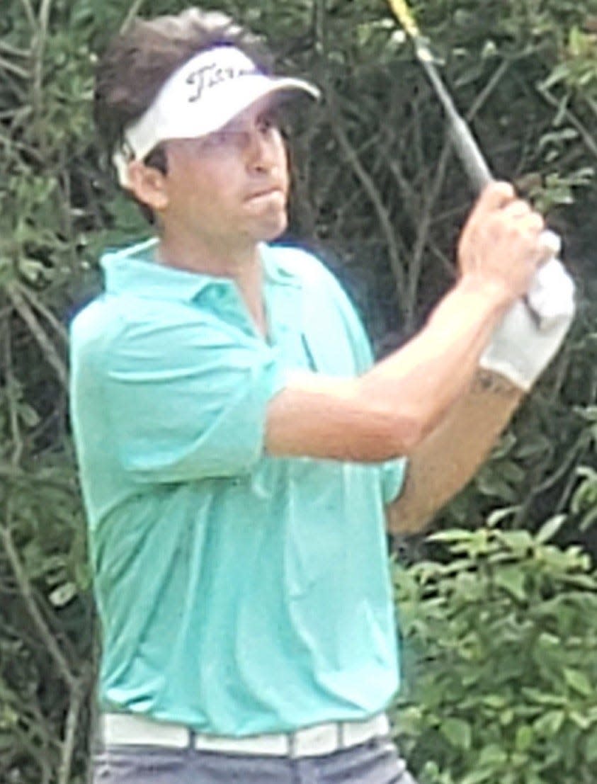 Gunnar McCollins, champion of the Open Division, watches his tee shot on the four hole at Raccoon Hill.