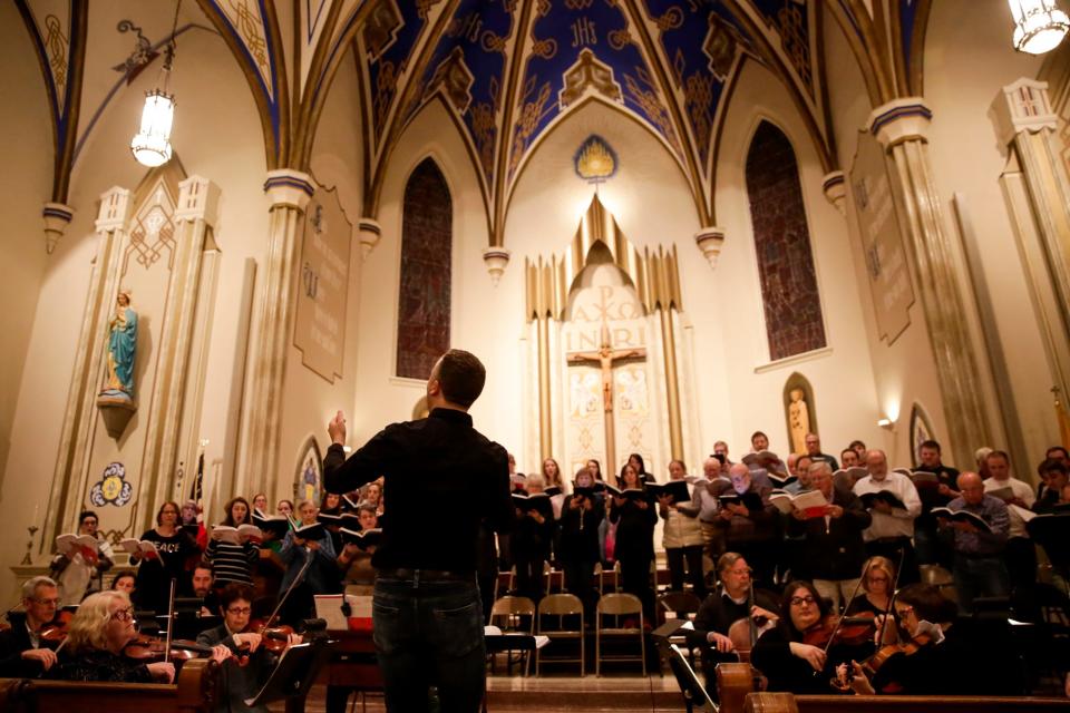 Michael Bennett leads the Lafayette Master Chorale during a rehearsal of Handel's Messiah on Dec. 18, 2019 at St. Boniface Church in Lafayette.