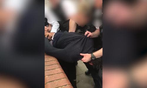 Met police criticised over video of forceful restraint of black man