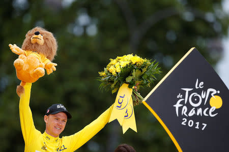 Cycling - The 104th Tour de France cycling race - The 103-km Stage 21 from Montgeron to Paris Champs-Elysees, France - July 23, 2017 - Team Sky rider and yellow jersey Chris Froome of Britain celebrates his overall win on the podium. REUTERS/Christian Hartmann