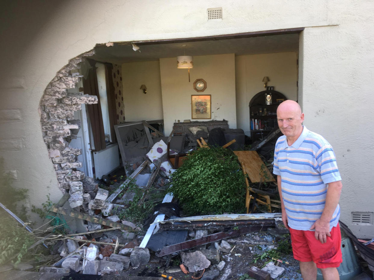 <em>Devastation – a car left a giant hole in the side of Tony Ross’ house after ploughing into it (Picture: SWNS)</em>