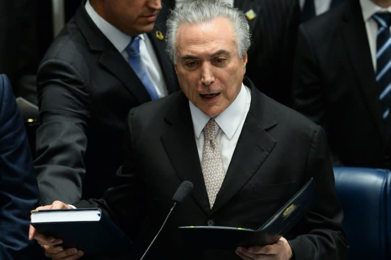 President Michel Temer swears in to take office before the plenary of the Brazilian Senate in Brasilia, on August 31, 2016