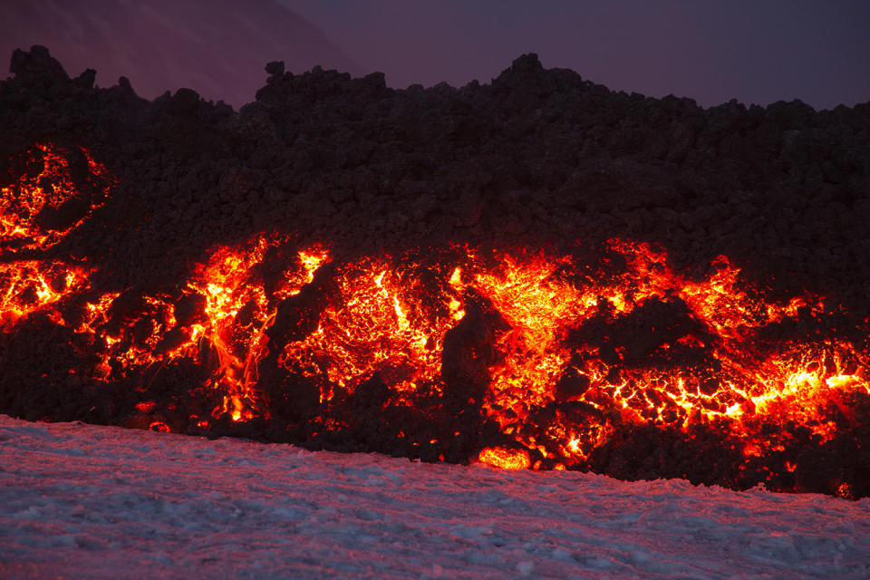 <p>Mount Etna, Europe’s most active volcano, spews lava during an eruption, near the Sicilian town of Catania, southern Italy, Tuesday, Feb. 28, 2017. (Marco Restivo/Barcroft Images/Barcroft Media via Getty Images) </p>