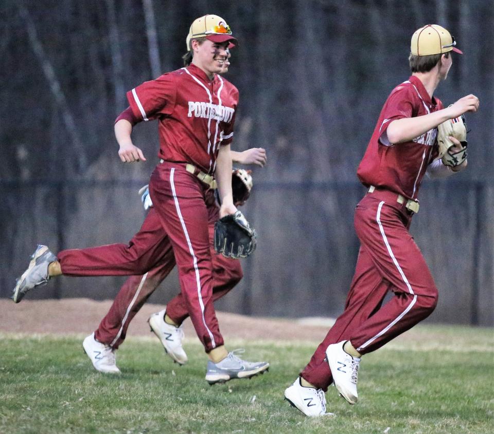 Members of the Portsmouth High School baseball team head off the field during Friday's 7-0 win over Salem.