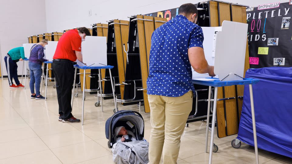 Voters fill out their ballots at a polling place in Omaha on November 3, 2020. - Nati Harnik/AP