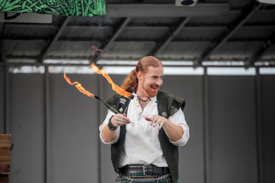 Daniel Greenwolf performs with fire at the Delaware Renaissance Faire in Townsend on Sunday, Nov. 6, 2022.