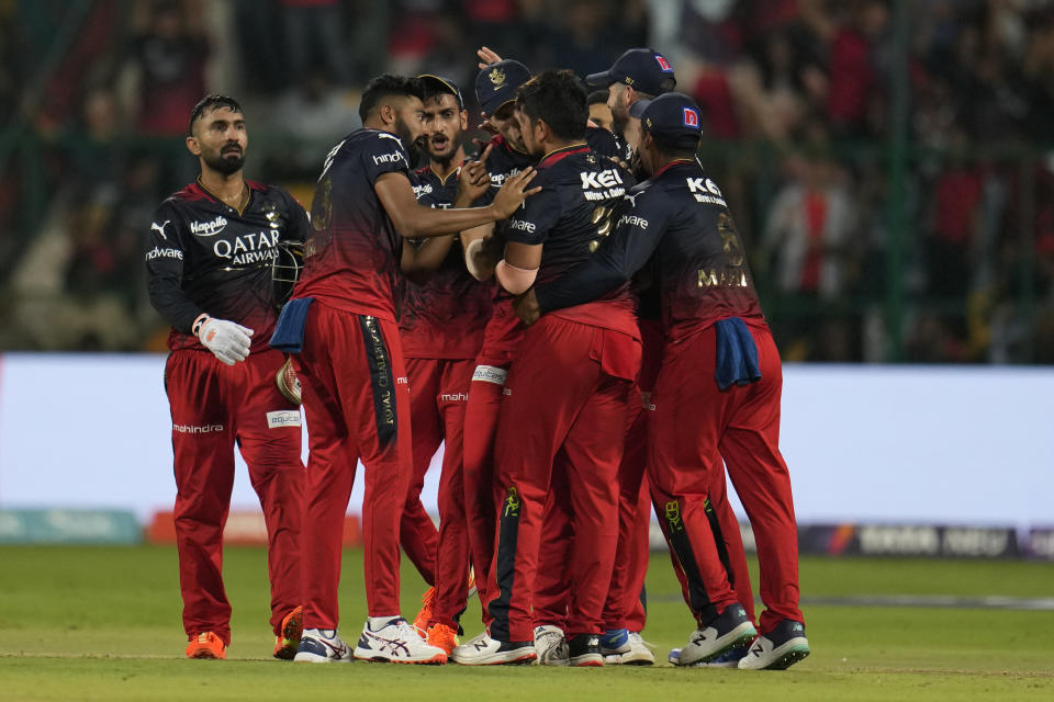 Royal Challengers Bangalore players celebrate the dismissal of Lucknow Super Giants' Marcus Stoinis during the Indian Premier League cricket match between Royal Challengers Bangalore and Lucknow Super Giants in Bengaluru, India, Monday, April 10, 2023. (AP Photo/Aijaz Rahi)