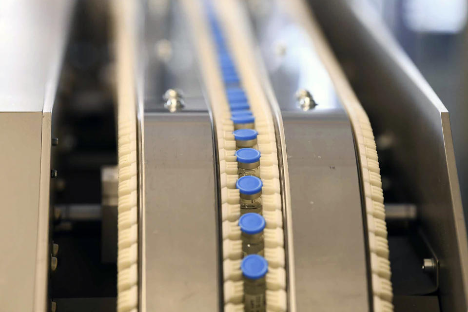 Vials of the Johnson & Johnson vaccine move on a conveyor belt at ASPEN Pharmaceuticals in Port Elizabeth, South Africa, Monday, March 29, 2021. The World Health Organization says the continent of 1.3 billion people is facing a severe shortage of vaccine at the same time a new wave of infections is rising across Africa. (AP Photo)