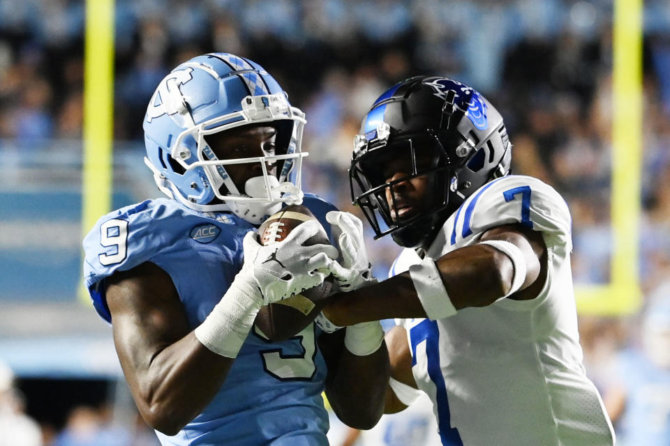 Nov 11, 2023; Chapel Hill, North Carolina, USA; North Carolina Tar Heels wide receiver <a class="link " href="https://sports.yahoo.com/ncaaf/players/321624" data-i13n="sec:content-canvas;subsec:anchor_text;elm:context_link" data-ylk="slk:Devontez Walker;sec:content-canvas;subsec:anchor_text;elm:context_link;itc:0">Devontez Walker</a> (9) catches the ball as <a class="link " href="https://sports.yahoo.com/ncaaf/teams/duke/" data-i13n="sec:content-canvas;subsec:anchor_text;elm:context_link" data-ylk="slk:Duke Blue Devils;sec:content-canvas;subsec:anchor_text;elm:context_link;itc:0">Duke Blue Devils</a> cornerback Al Blades Jr. (7) defends in the first quarter at Kenan Memorial Stadium. Mandatory Credit: Bob Donnan-USA TODAY Sports