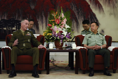 Chairman of the US Joint Chiefs of Staff, General Joseph Dunford (L) meets Chinese vice chairman of the Central Military Commission Fan Changlong (R) in Beijing on August 17, 2017. REUTERS/Wang Zhao/Pool