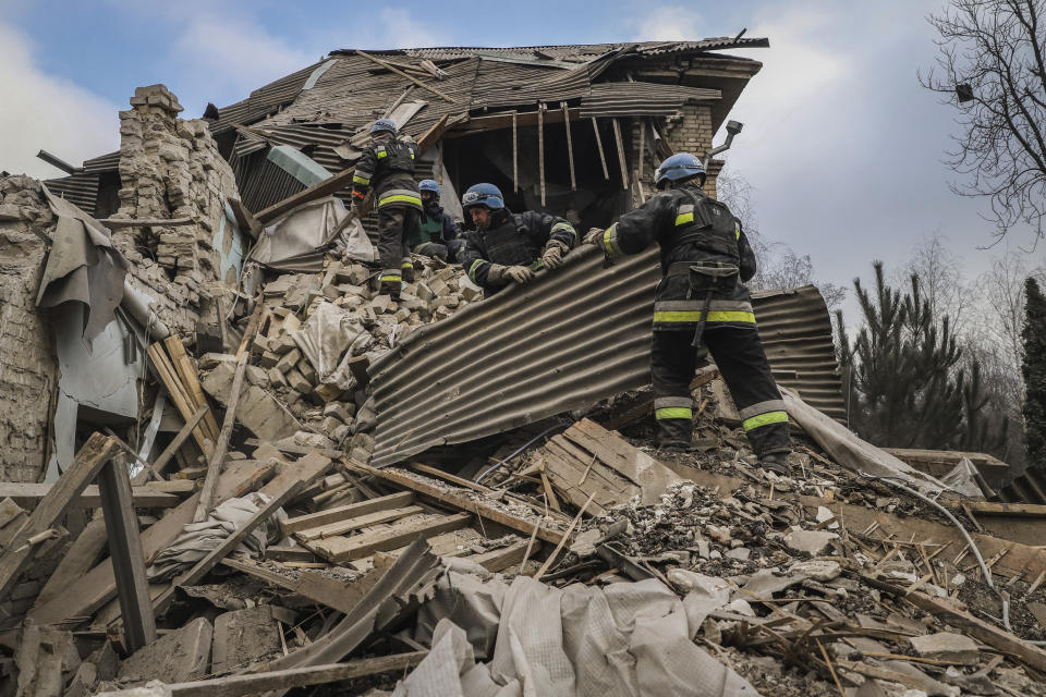 FILE - Ukrainian firefighters work at a damaged hospital maternity ward in Vilniansk, Zaporizhzhia region, Ukraine, Wednesday, Nov. 23, 2022. A Russian rocket struck the maternity wing of a hospital in eastern Ukraine on Wednesday, killing a newborn boy and critically injuring a doctor. (AP Photo/Kateryna Klochko, File)