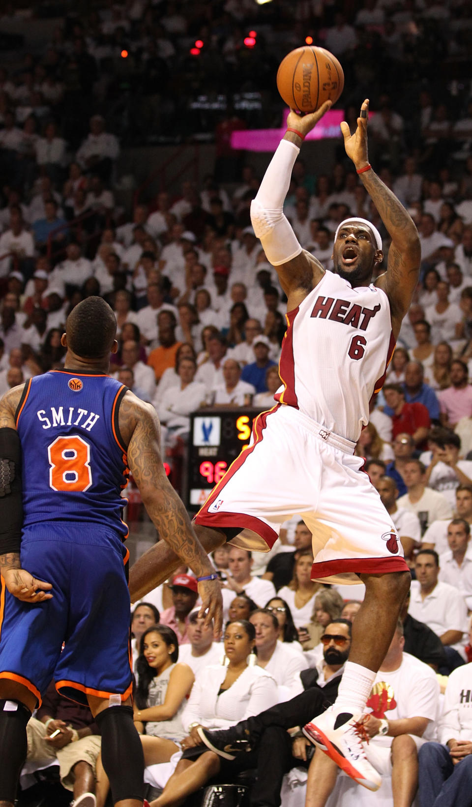 MIAMI, FL - MAY 09: Forward LeBron James #6 of the Miami Heat shoots against the New York Knicks in Game Five of the Eastern Conference Quarterfinals in the 2012 NBA Playoffs on May 9, 2012 at the American Airines Arena in Miami, Florida. Miami defeated the Knicks 106-94 to advance to the next round four games to one. NOTE TO USER: User expressly acknowledges and agrees that, by downloading and or using this photograph, User is consenting to the terms and conditions of the Getty Images License Agreement. (Photo by Marc Serota/Getty Images)