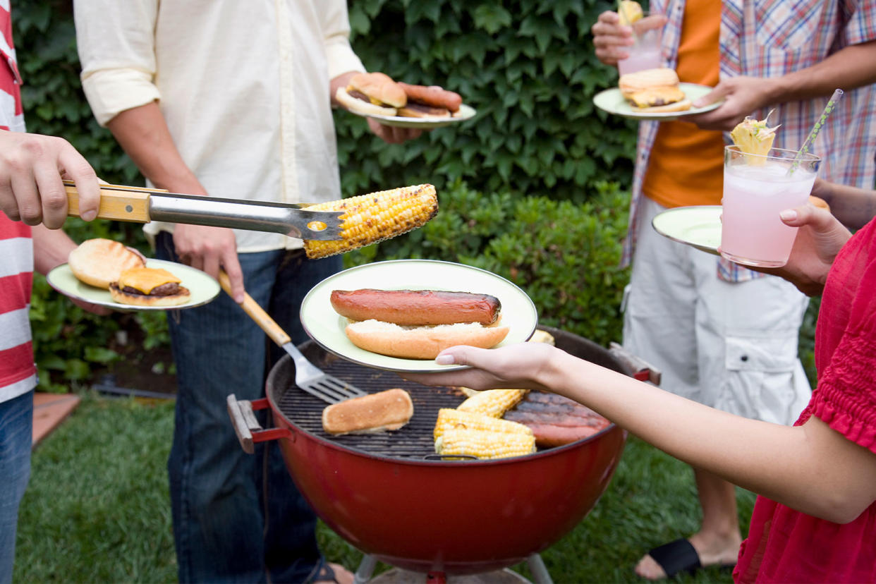 Friends having a BBQGetty Images/Ronnie Kaufman