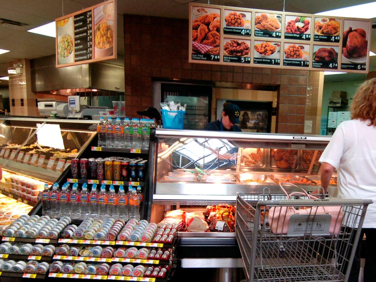 Customers at the deli counter of a Walmart in Rogers, Arkansas