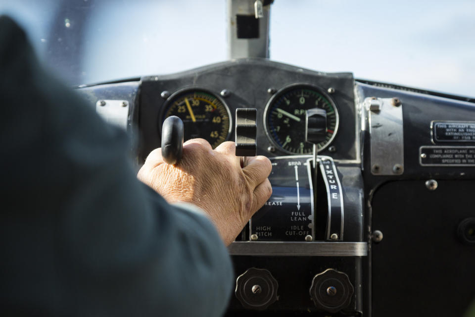 A person in the cockpit of a plane