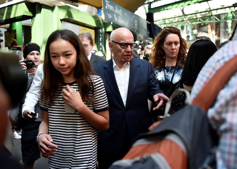 FILE PHOTO: News Corp CEO Rupert Murdoch, with one of his daughters and Rebekah Brooks, visit Borough Market, which officially re-opened today following the recent attack, in central London