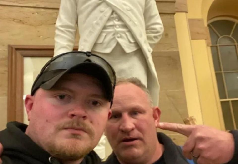 Jacob Fracker (left) and Thomas Robertson (right) inside the US Capitol on January 6 (DOJ)