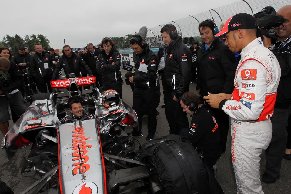 WATKINS GLEN, NY - JUNE 14: Tony Stewart talks while he sits in the Vodafone McLaren Mercedes MP4-23 with Lewis Hamilton during the Mobil 1 Car Swap at Watkins Glen International on June 14, 2011 in Watkins Glen, New York. (Photo by Nick Laham/Getty Images for Mobil 1)