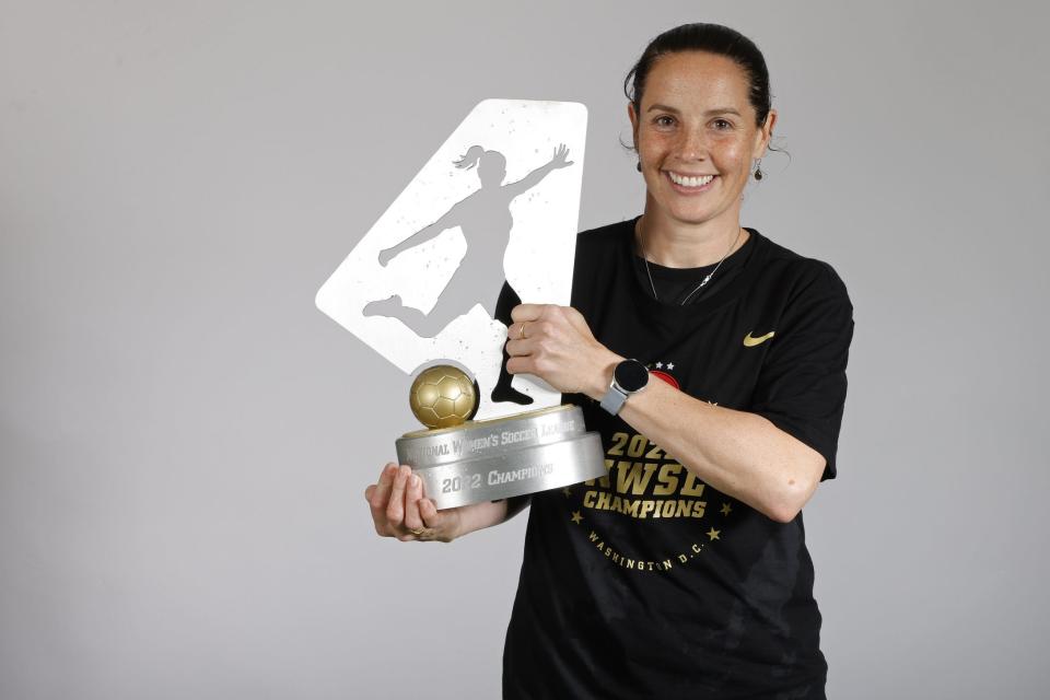 Oct 29, 2022; Washington, D.C., USA; Portland Thorns FC head coach Rhian Wilkinson poses with the previous championship trophy after the NWSL championship game against Kansas City Current at Audi Field. Mandatory Credit: Geoff Burke-USA TODAY Sports
