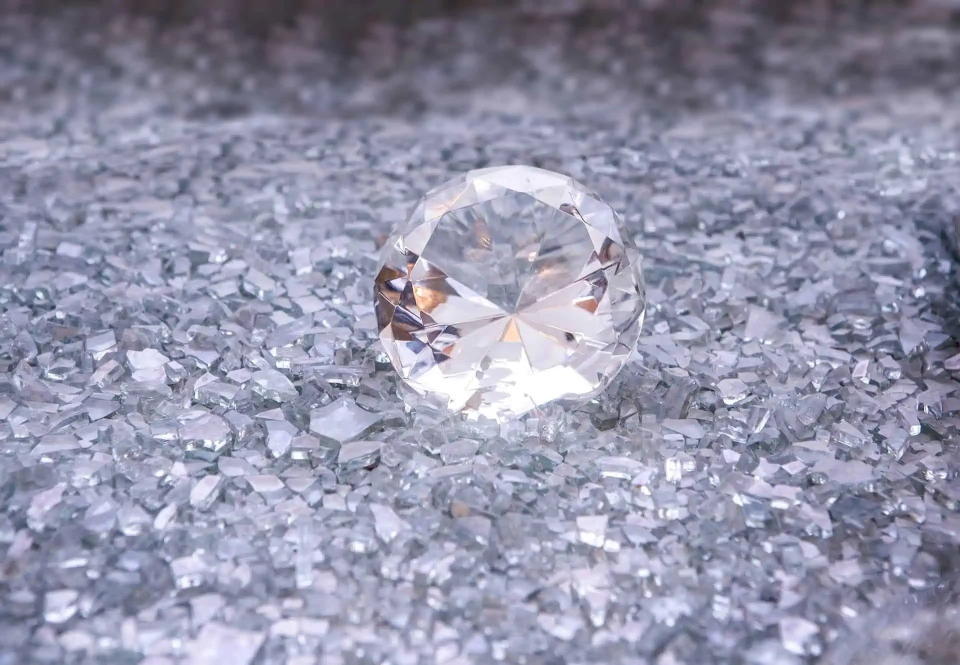 Large diamond around several tiny diamonds.