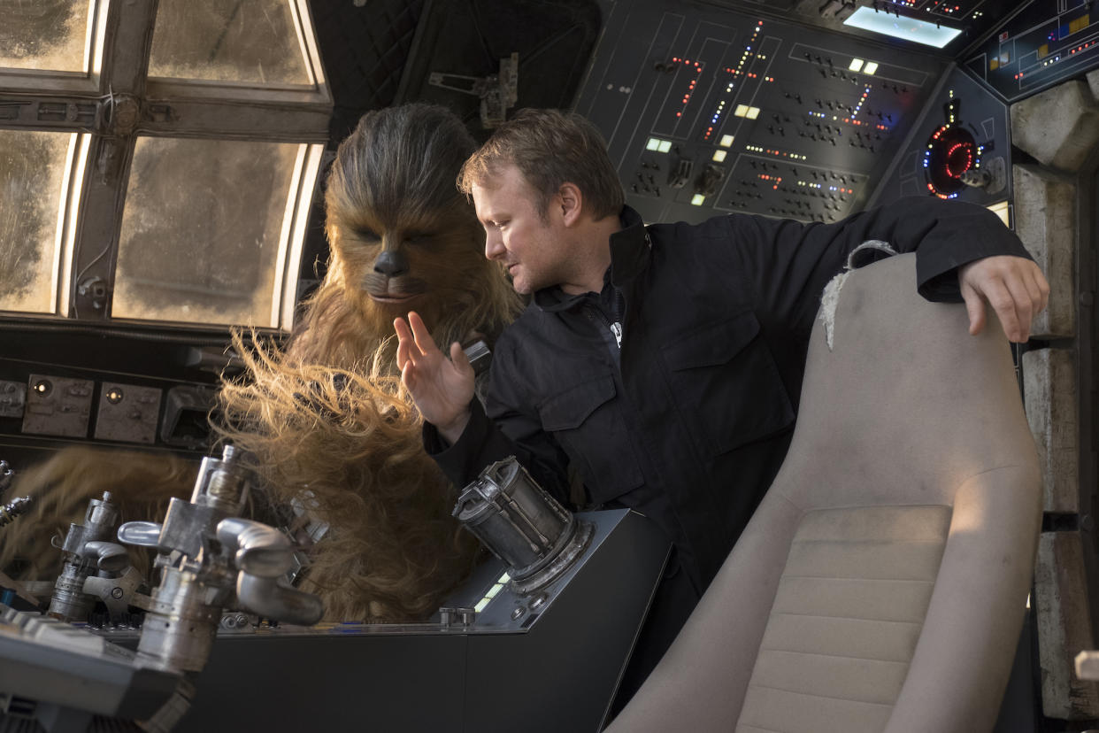 Chewbacca gets some Millennium Falcon-flying tips from director Rian Johnson. (Photo: Lucasfilm)