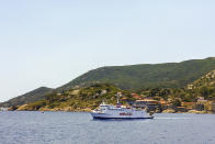 A ferry leaves Giglio island, near the Italian coast of Tuscany, Tuesday, June 23, 2020. In spite of various people with coronavirus stopped by the island at times, no one of the islanders developed COVID-19 infection. For Paola Muti, a professor of Epidemiology, being trapped by lockdown in her late mother’s house for months on Giglio Island, the situation also made for an opportunity to possibly contribute to scientific understanding of why some people in close contact with people ill with COVID-19 don’t get infected. (AP Photo/Paolo Santalucia)