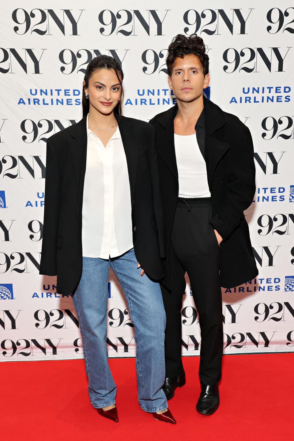 Camila Mendes in NYC wearing a pair of red pointed-toe shoes