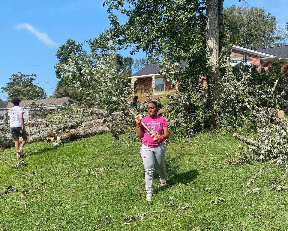 Athletes from Gadsden City High School turned out on Monday to assist with clean-up on Lookout Mountain following last week's severe storm that downed trees and damaged homes in the area.