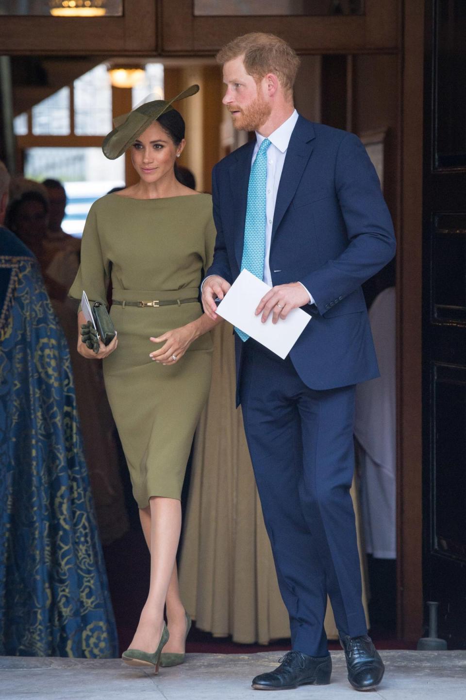 Princess Louis, 2018: For their nephew’s christening, the Duchess of Sussex wore a belted olive-coloured Ralph Lauren dress, styled with a Stephen Jones hat of the same colour. The looked was teamed with a pair of matching coloured pumps, gloves, and a clutch bag. Meanwhile, the Duke of Sussex wore a navy suit, white shirt, and light blue tie. (Getty Images)