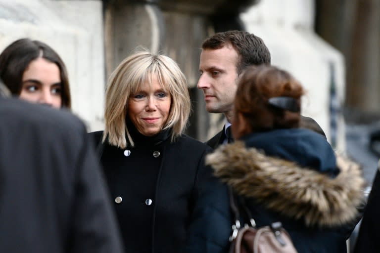 Emmanuel Macron (centre right) with wife Brigitte Trogneux (centre left) at a funeral on November 10, 2016 in Paris