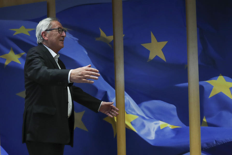 European Commission President Jean-Claude Juncker welcomes incoming European Commissioner for Economy Paolo Gentiloni before their meeting at the EU headquarters in Brussels, Tuesday, Oct. 15, 2019. The European Union said Tuesday that a Brexit divorce deal is possible this week but that the British government's proposals so far are not sufficient to seal an agreement. (AP Photo/Francisco Seco)