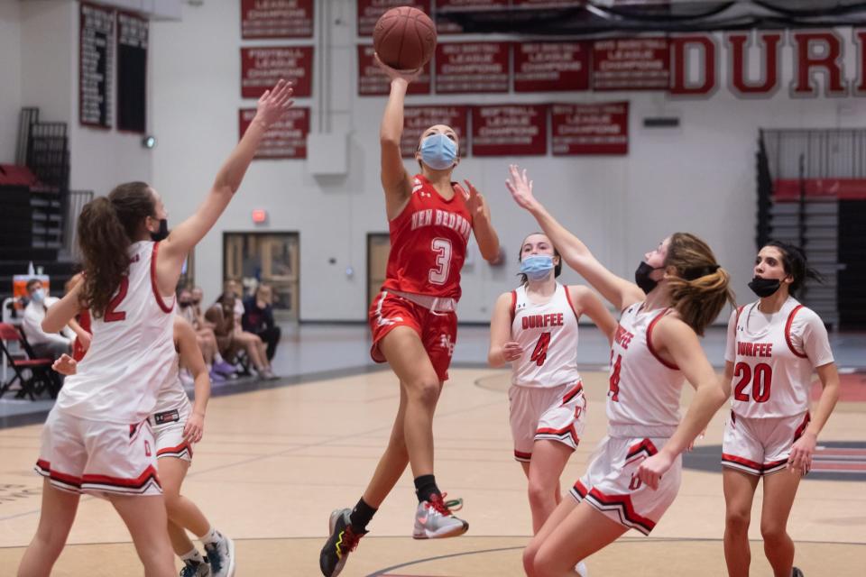 New Bedford’s Lexi Thompson soars through the paint for a lay-up on Wednesday against Durfee.