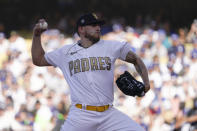 FILE - National League pitcher Joe Musgrove, of the San Diego Padres, throws a pitch to the American League during the third inning of the MLB All-Star baseball game, on July 19, 2022, in Los Angeles. Musgrove has helped the Padres clinch an NL wild-card spot, just the seventh playoff berth in the team's 54-year history. What he really wants is another World Series ring that he would consider more legitimate than the one he won with Houston in 2017. (AP Photo/Mark J. Terrill, File)