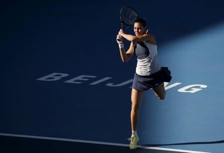 Flavia Pennetta of Italy hits a return against Anastasia Pavlyuchenkova of Russia during their women's singles match at the China Open tennis tournament in Beijing, China, October 8, 2015. REUTERS/Kim Kyung-Hoon - RTS3IA3