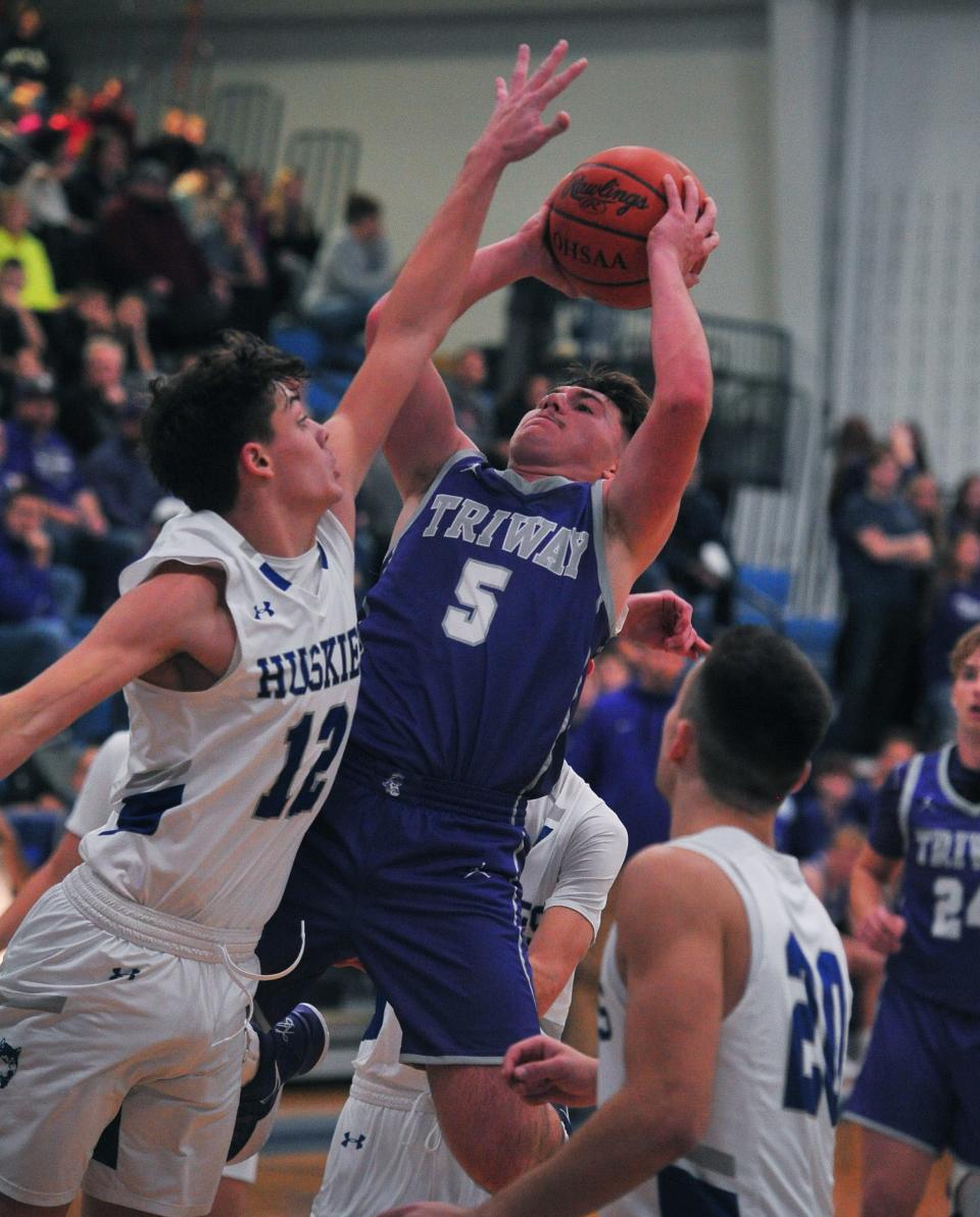 Triway's Zack Miller attacks against Northwestern. He scored a game-high 27 and hit the game-winner to open his senior season.