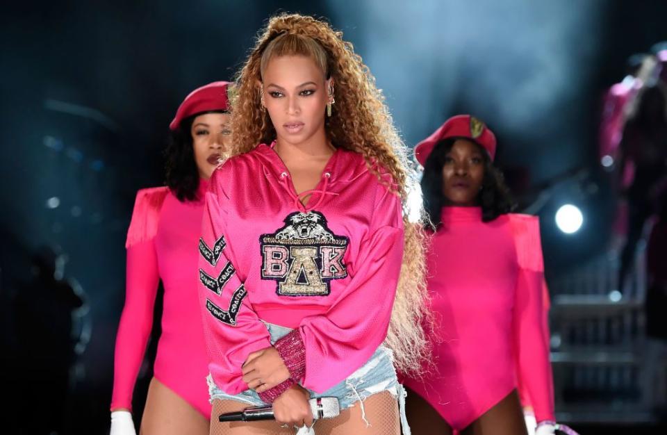 <p>During the second weekend of Coachella, Beyoncé rocked the same looks as the first week - but in all new colours. The yellow hoodie she wore for the first weekend performance was replaced by this hot pink version. The sequinned letters–her initials and the Greek delta symbol–are in a collegiate style, which fit with her big band accompaniment. The sweatshirt draws on the Greek lettering of American sororities, where black women have historically had to fight for their place. Beyoncé took a recognisable style ingrained in American culture, made it her own, and performed "Lift Every Voice and Sing," which is considered to be the black national anthem. </p>