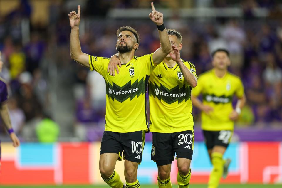 Crew forward Diego Rossi (10) celebrates with midfielder Alexandru Matan (20) after scoring the first of his two goals Saturday.