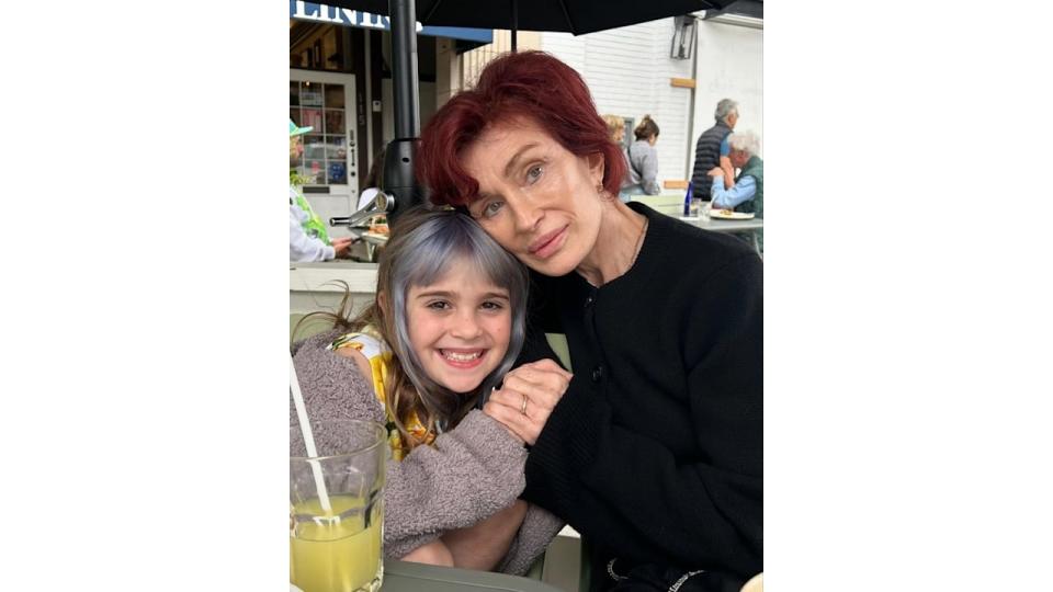 Sharon Osbourne cuddles into her granddaughter Andy