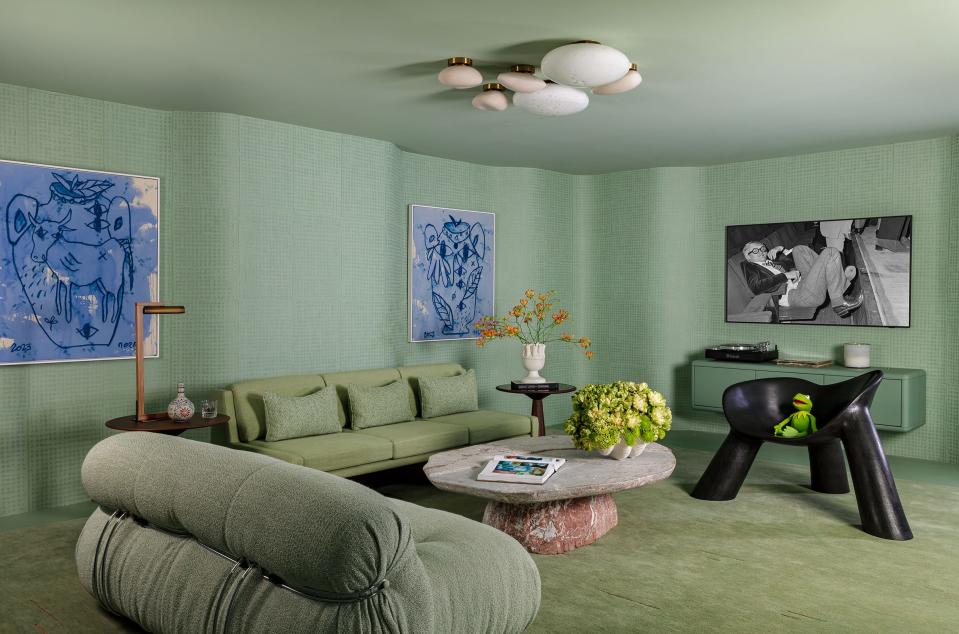 For the Kips Bay Decorator Show House Palm Beach. interior designer Nicole Mizrahi and architect Kevin Lichten used a gentle green and rounded wall forms to create a relaxed retreat honoring Kermit the Frog, who is seated on the chair at right,