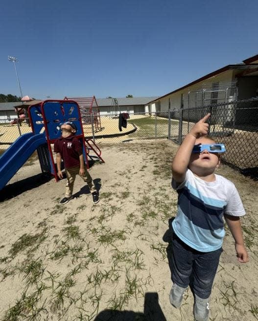Thomas Heyward Academy students look to the skies to watch the eclipse.