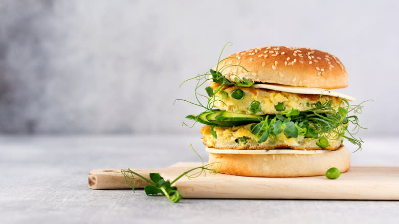 Veggie burger garnished with pea shoots