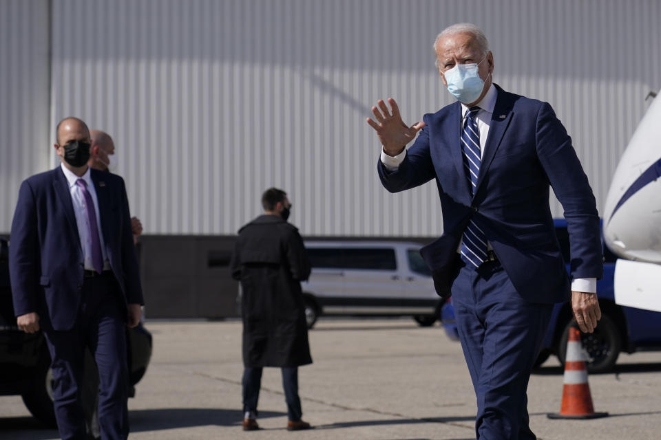 Democratic presidential candidate former Vice President Joe Biden waves as he arrives at Detroit Metropolitan Wayne County Airport, Friday, Oct. 16, 2020, in Detroit. (AP Photo/Carolyn Kaster)