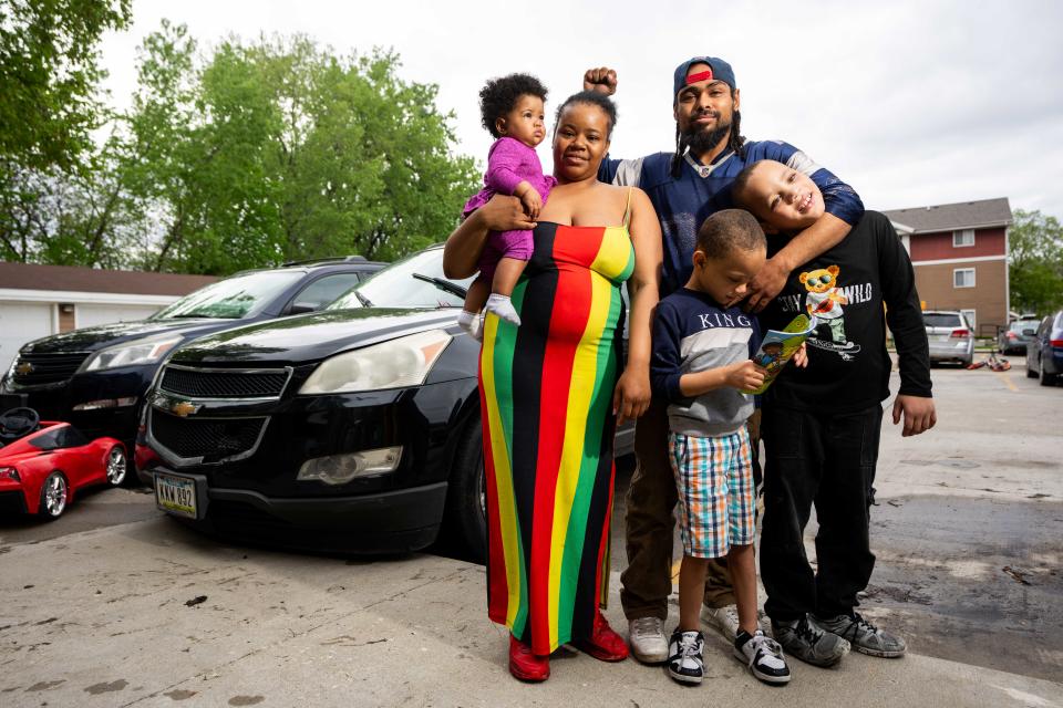 Aspen Apartments residents Essence Hudson, her boyfriend, Joe Ward, and children Quinton, Clarence and Sypher stand for a photo Thursday, May 2, 2024, at their apartment in Des Moines.