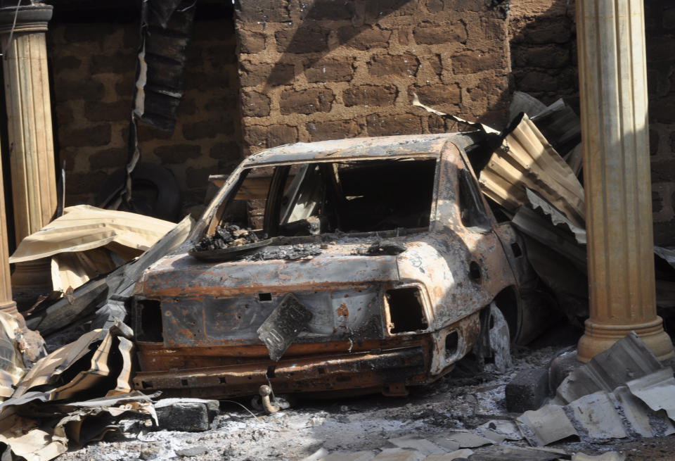 A burnt out car is seen following an attacked by gunmen in Bokkos, north central Nigeria, Tuesday, Dec. 26, 2023. Nigerian officials and survivors say at least 140 people were killed by gunmen who attacked remote villages in north-central Nigeria's Plateau state in the latest of such mass killings this year blamed on the West African nation's farmer-herder crisis. (AP Photo)