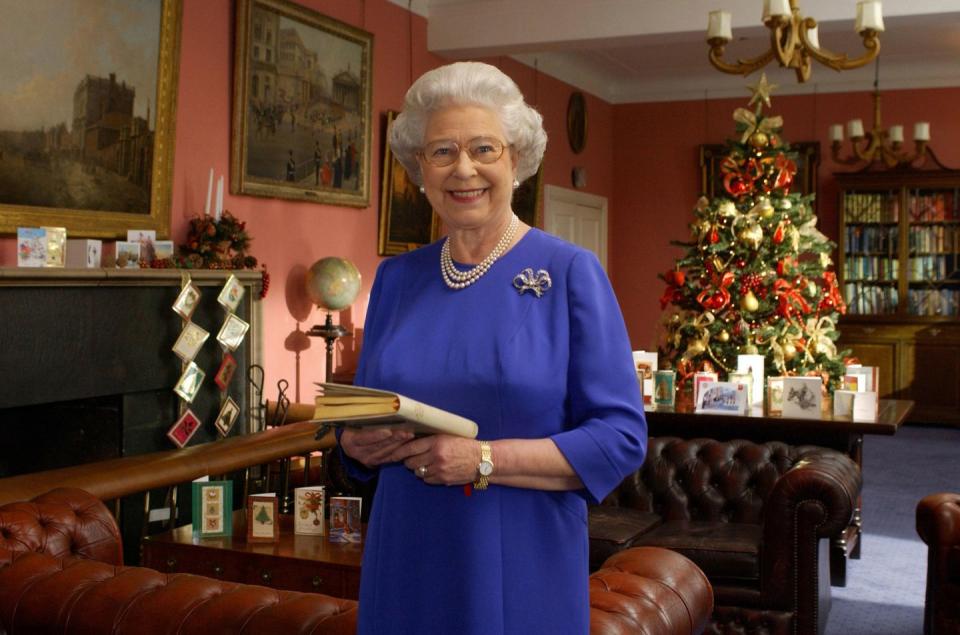 <p>Looking regal in a gorgeous blue dress, the monarch stands poised as she prepares to deliver her annual Christmas address from Buckingham Palace.</p>