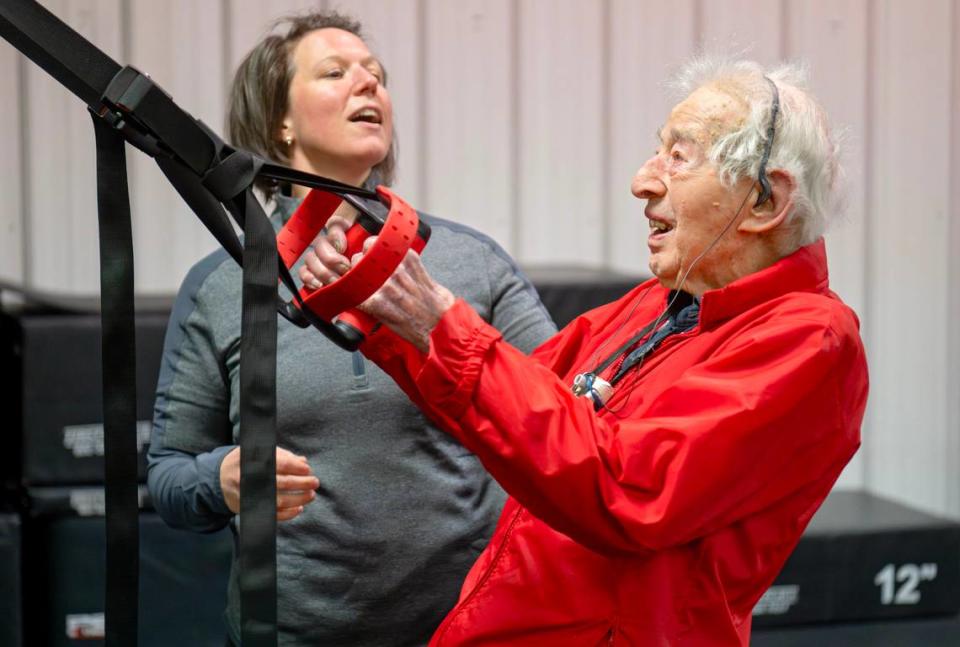 Trainer Berta DeDonato reminds George Etzweiler to keep his head up as he exercises at Ki’netik Fitness on Friday, April 5, 2024.