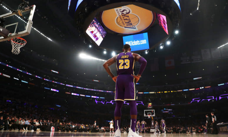 LeBron James stands at the baseline in Staples Center during a Lakers game.