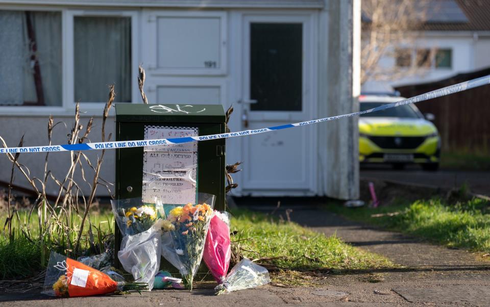 Floral tributes were left at the scene in Milton Keynes on Wednesday - Joe Giddens/PA